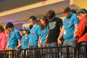 Students pray during the final session of YEC Tuesday, Nov. 24. Brian Blackwell photo