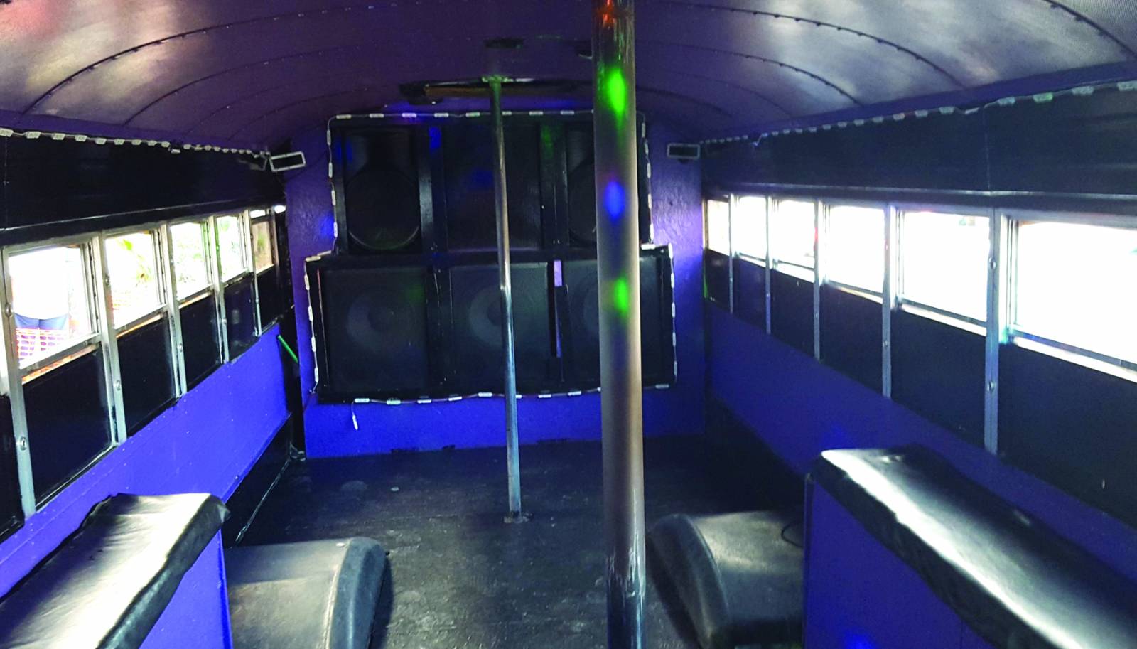The purple-painted party bus included what was described as brass stripper’s poles as part of its interior motif.
