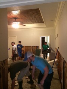 Members of Bonita Road Baptist Church in Bastrop help a fellow church member clean up her damaged home, following flooding in Morehouse Parish.
