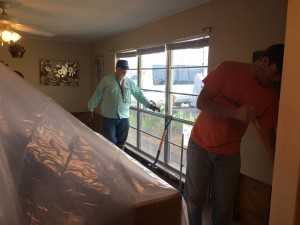 Northwestern State University BCM Director Bill Collins and a member of the BCM work on the home of Josh Currie, pastor of Trinity Baptist Church in Natchitoches. Currie's home received some floodwater but he plans to move back into his home once renovations are complete.
