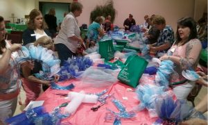 Ladies attending the Christmas in July event at Florida Boulevard Baptist Church make wreaths. Submitted photo