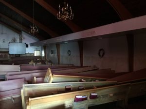 Damaged pews are scattered throughout the worship center of Don Avenue Baptist Church in Denham Springs.