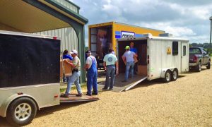 Supplies from Tennessee Baptists are offloaded from trailers by volunteers at Fairhaven Ministry in Covington. The supplies are being distributed to churches and relief centers in the hard-hit Denham Springs area.