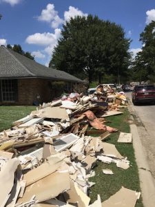 Mountains of debris from cleaned out houses extend for as far as the eye can see in subdivisions throughout the Baton Rouge areas. Hundreds of volunteers are working to remove wet sheetrock, carpet and insulations from flooded houses. Brian Blackwell photo