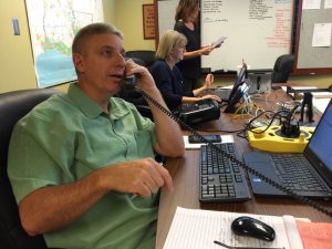 Keith Manuel, evangelism associate for Louisiana Baptists, answers a telephone call at the state disaster relief incident command center in Alexandria.