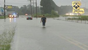 A Louisiana State Police Trooper and an East Baton Rouge Sheriffs Office Deputy rescue a stranded motorist from their submerged vehicle on Reiger Rd. near Interstate 10.  The right lane is closed on I-10 Eastbound between Siegen Lane and Highland Road in Baton Rouge due to water on the roadway. Please avoid the area and expect delays.
