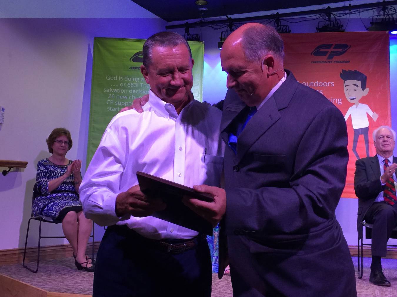 Cecil Gassiott, the owner of construction company in Alexandria, accepts a plaque of appreciation from John Hebert, missions and ministry director for Louisiana Baptists. Gassiott, a member of Calvary Baptist Church in Woodworth, is among many who have given financial and volunteer resources to help make the Georgia Barnette Conference Center possible.
