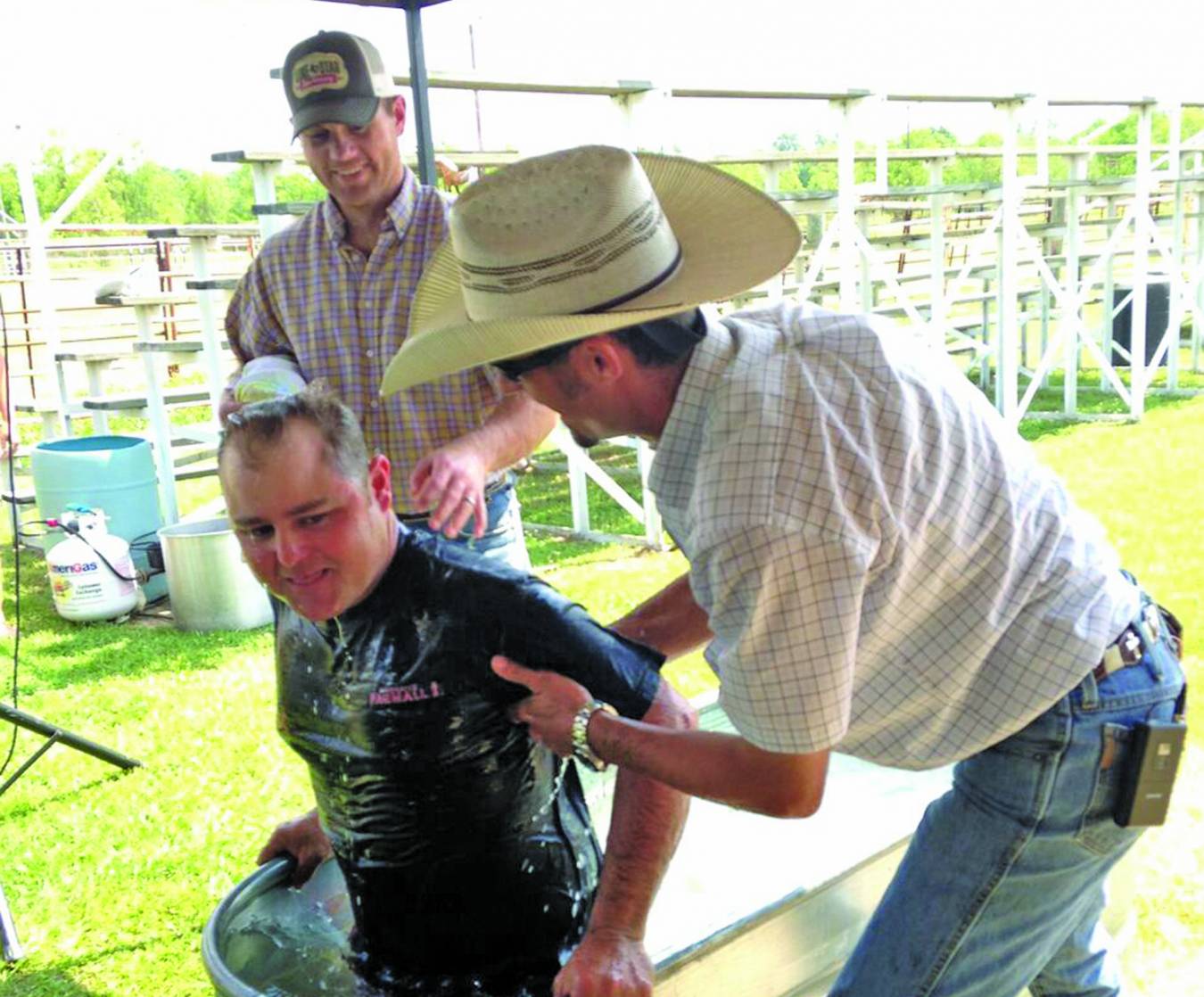 Cross Creek Cowboy Church Pastor Josh Morris baptizes a new believer.