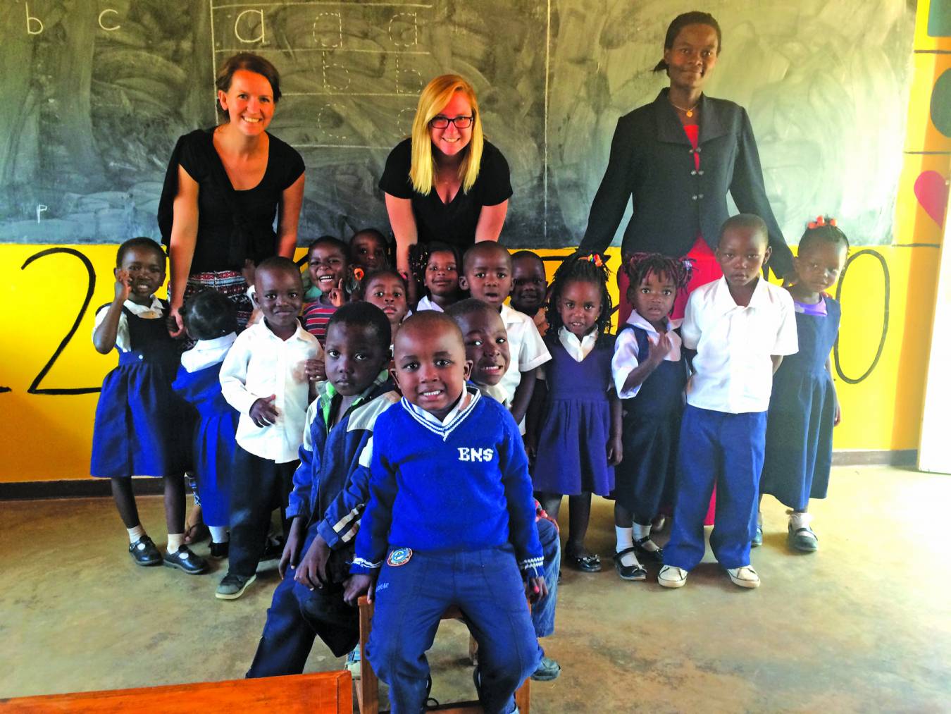 Rector taught English to young school children in Malawi.