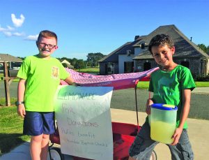 Instead of playing X-Box or being bored, Hunter Schneider and Hunter Hayden, who both attend First Baptist, Haughton, put together a lemonade stand to raise money to help the victims of the south Louisiana floods. They were able to give $250 toward flood relief.