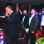 Ministers lift their hands to pray for Baton Rouge Mayor Sharon Broome during the Pastors’ Rally co-sponsored by Louisiana Office of Public Policy.