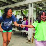 LSU student Catarina Kim shares a laugh with a resident of the special needs orphanage her team visited during a mission trip to Mexico.