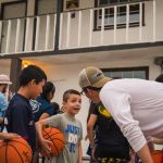 Children talk to a BCM student leading a sports clinic in Mexico. Ten people accepted Christ by participating in the clinic.