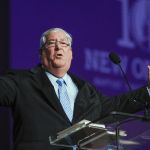 Chuck Kelley, president of New Orleans Baptist Theological Seminary, gives a report to messengers at the Southern Baptist Convention annual meeting on the last day of the two-day event in Dallas June 13. He shared about the success of the seminary's expansion of online education, its commitment to diversity and its commitment to evangelism among other accomplishments. Van Payne photo