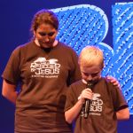 Jax, a youngster from First Baptist Church in Keithville, prays during a session of PreTeen Invasion. He opted to attend the event when faced with the choice of instead attending a football jamboree in south Shreveport.
