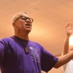 An inmate at the Louisiana State Penitentiary at Angola lifted his hands toward heaven during a time of worship at a revival on the prison grounds September 19.