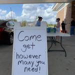 A sign welcomed motorists to pick up meals at First Baptist Church in Moss Bluff. Brian Blackwell photo/Taken Sept. 2.