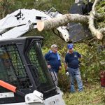 South Carolina Baptist Disaster Relief team members look on a Bobcat was used to remove debris that fell near the parsonage at Simpson Baptist Church in Simpson. Brian Blackwell photo/Taken Sept. 1.