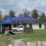 Members of the University of Louisiana-Lafayette Baptist Collegiate Ministry tarped the home of Joe Arnold, Bayou Baptist Association Director of Missions. Mark Robinson photo